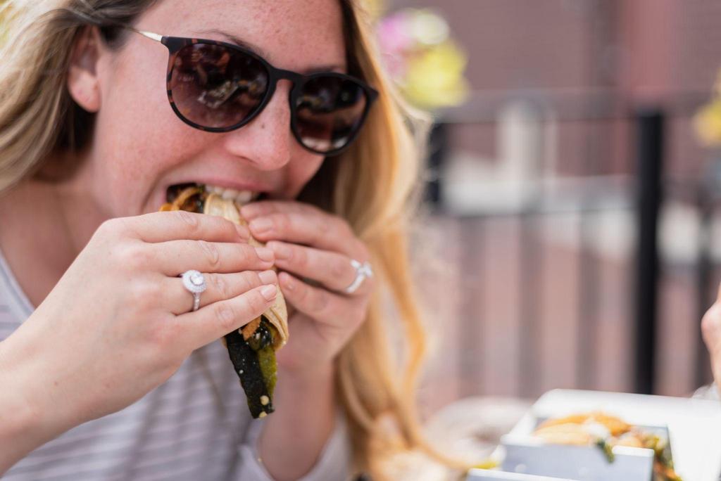 A pregnant woman making healthy choices at Chipotle with grilled chicken, brown rice, and beans.